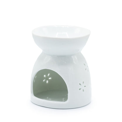 Carefully sourced by The Original Candle Company and featuring a cut-out Buddha design in white, this oil burner and wax warmer will make an attractive decoration in any room. Image shows the rear of the burner where the tealight goes.