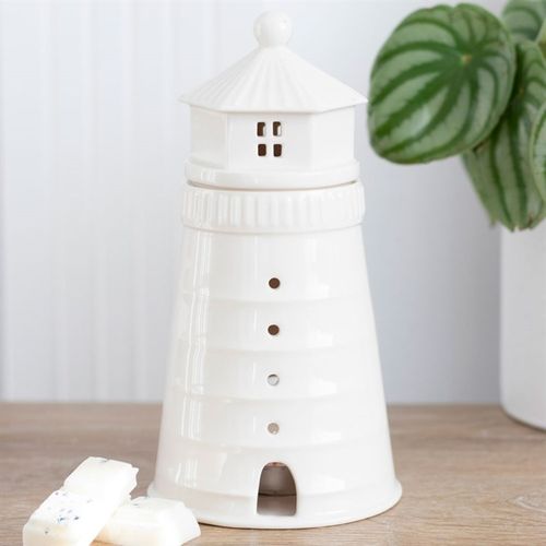 Curated by The Original Candle Company. Decorate and scent your home with this unique white lighthouse oil and wax melt warmer. Place a lit tealight inside to see a charming glow from the windows and remove the lighthouse lid to add your favourite home fragrance.