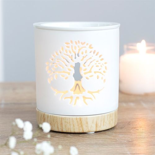 Carefully Sourced By The Original Candle Company. This white ceramic oil burner features a cut-out Tree of Life design with a wood-effect ceramic base. Place fragrance oil or wax melts into the built-in dish with a standard tealight inside to fill the home with calming fragrance.