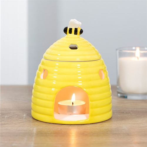 Sourced by The Original Candle Company. This ceramic oil burner comes in the shape of an adorable yellow beehive with a sweet bee on the lid. Honeycomb-shaped cutouts finish off this unique style. Always remove the lid whilst in use.