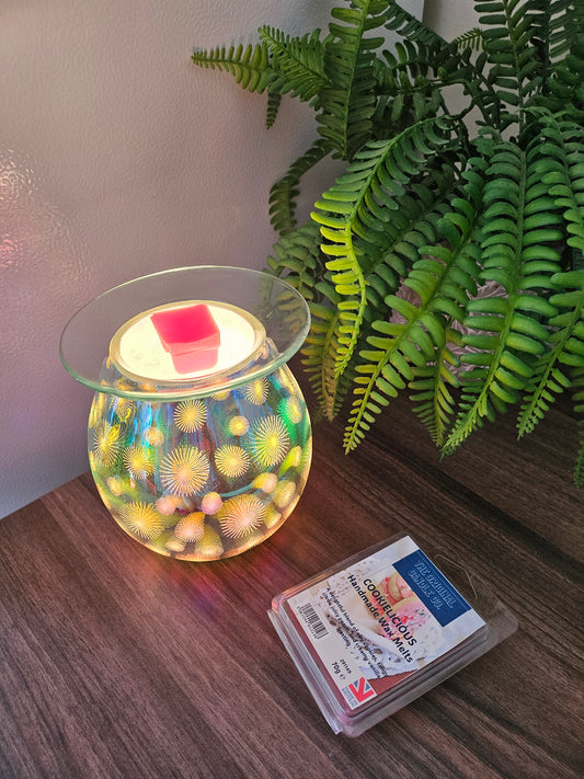 COOKIELICIOUS Wax Melts from The Original Candle Co., blending warm cookie dough with sweet vanilla frosting and juicy peach. A handcrafted wax melt designed to bring comforting and delicious aromas into your space.