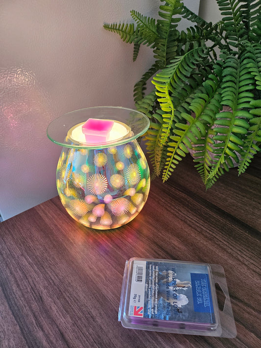WHISPERS OF LOVE Wax Melts from The Original Candle Co., blending delicate cyclamen and orange zest with lotus blossom, warm vanilla, powdery musk, and amber for a serene, romantic fragrance. A handcrafted wax melt designed to create an intimate and soothing atmosphere.